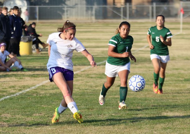 Lemoore's Chloe Chedester keeps her eye on the ball during action in the annual Lemoore Lady Tiger Soccer Tournament, which began Friday.